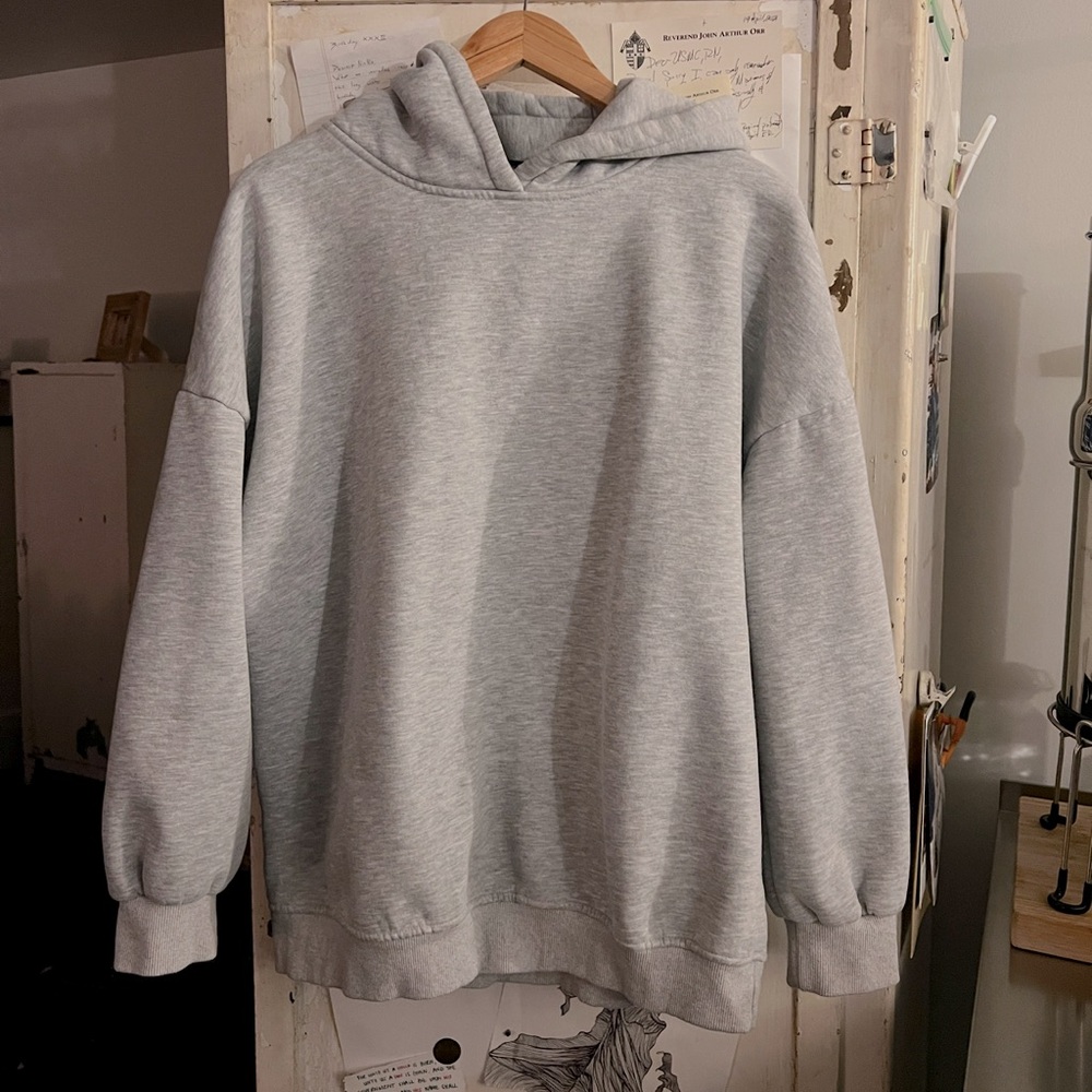 Woman’s oversized grey hoodie